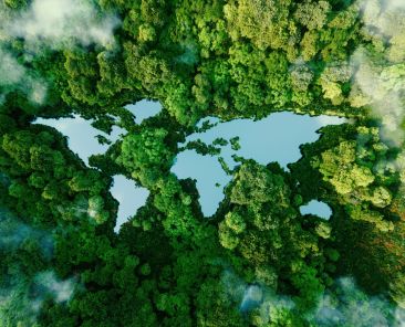 A lake in the shape of the world's continents in the middle of untouched nature. A metaphor for ecological travel, conservation, climate change, global warming and the fragility of nature.3d rendering